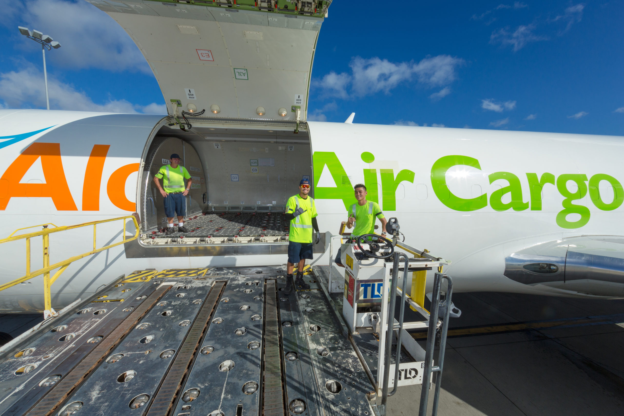 Cargo Services Employees on an Aloha Air Cargo plane.